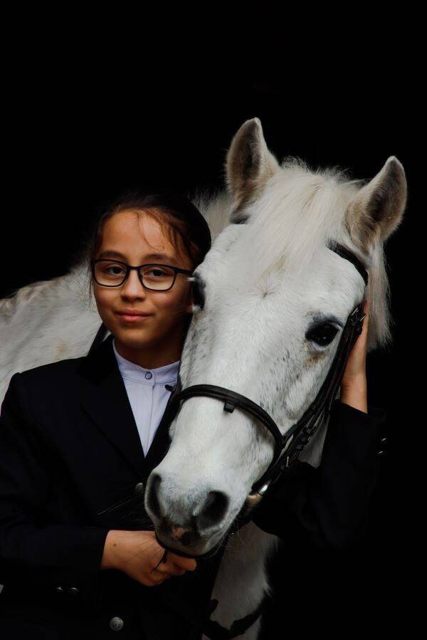 portrait of a rider and her equine partner