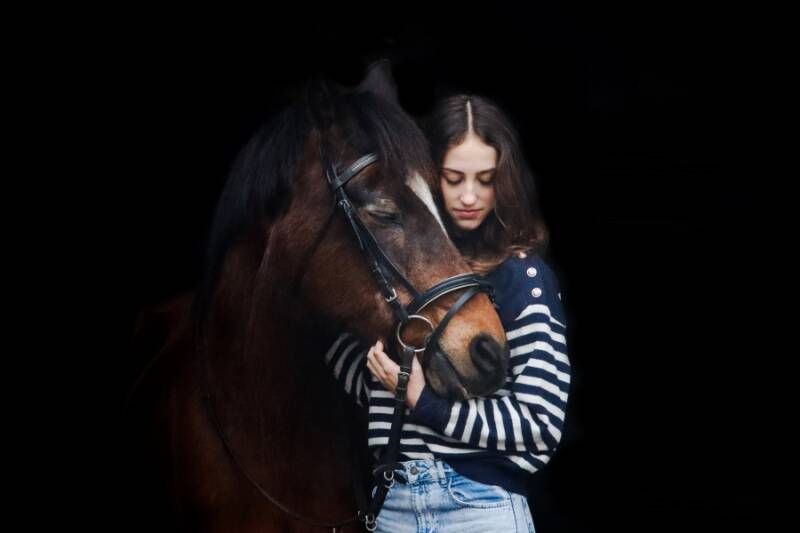 Blacklight pictures showing the intense equine - human bond.