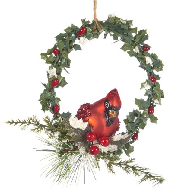 Rode kardinaal vogel in groene krans