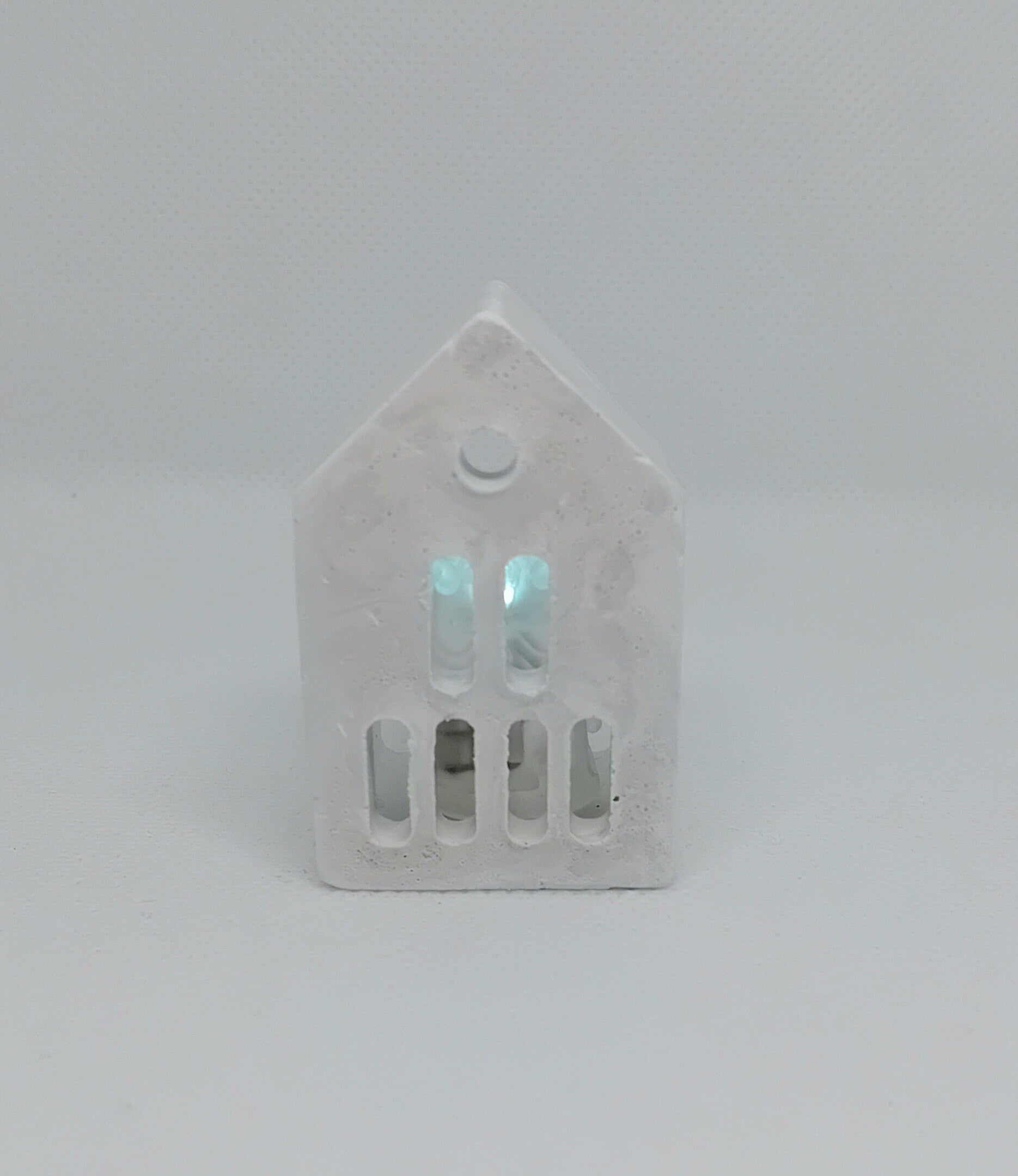 Kleine gips huisjes met verlichting