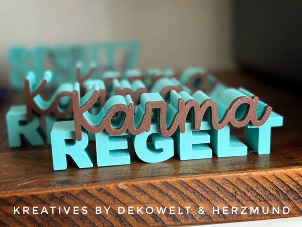Karma regelt Schriftzug