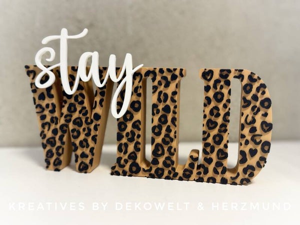 Schriftzug „stay wild“