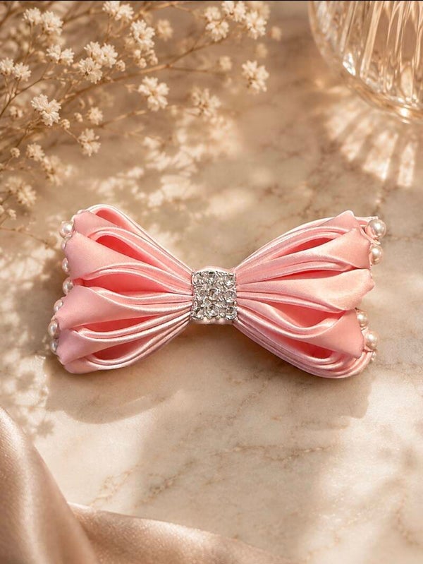 Noeud rose avec perles