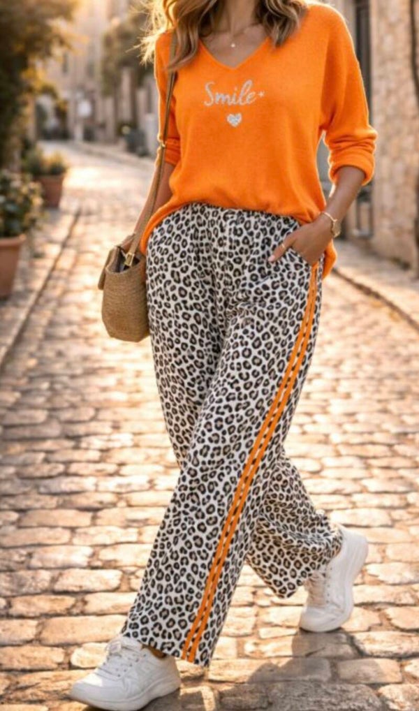 Pantalon léopard bande orange