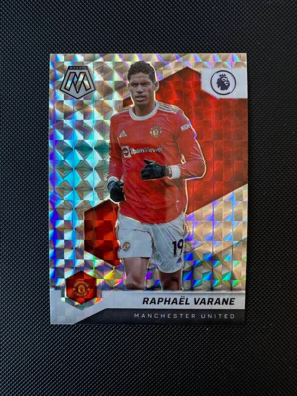 Raphael Varane Panini Mosaic Premier League 2021/22 Reactive Prizm #150 MAN. UTD.