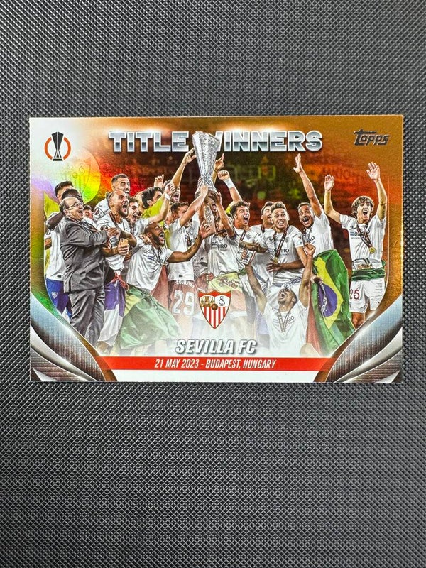 Sevilla FC /25 Topps UEFA CC 2023/24 Title Winners- Orange Foilboard #121 SEVILLA