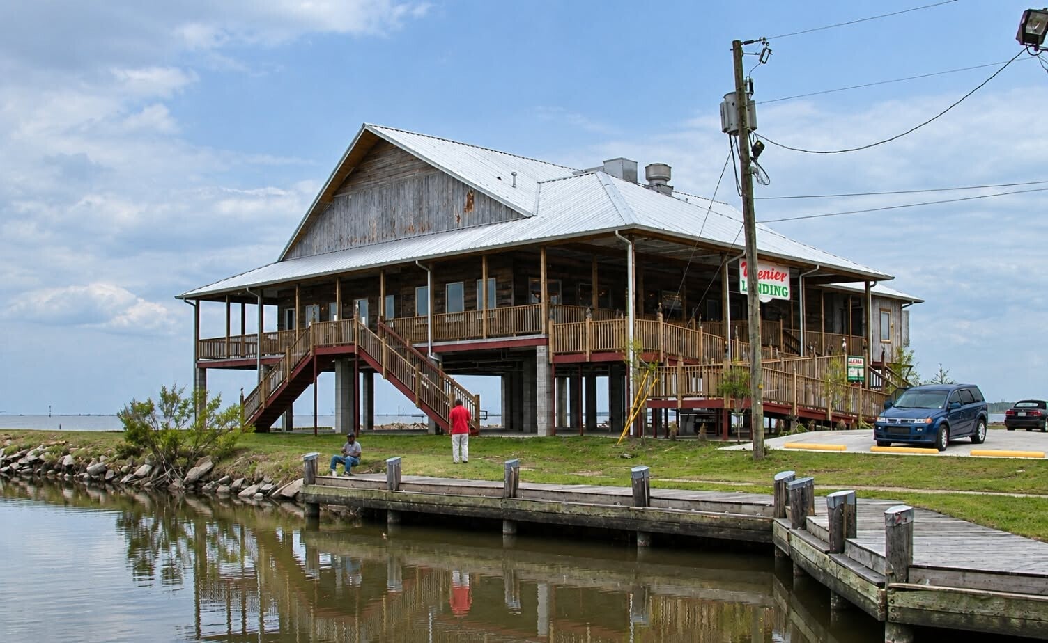 Frenier Landing restaurant building on stilts over the water with a wraparound deck