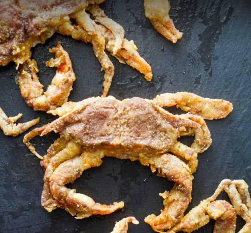 Golden fried Louisiana soft shell crabs on black slate, crispy breaded legs and bodies with seasoned flour coating, Daddy's recipe from NanaTee's Cajun Home
