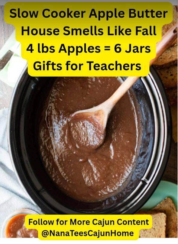 Slow cooker filled with thick, glossy dark brown apple butter and wooden spoon, surrounded by sliced bread for serving, easy 4-lb apple recipe that makes 6 jars for gifts from NanaTee's Cajun Home