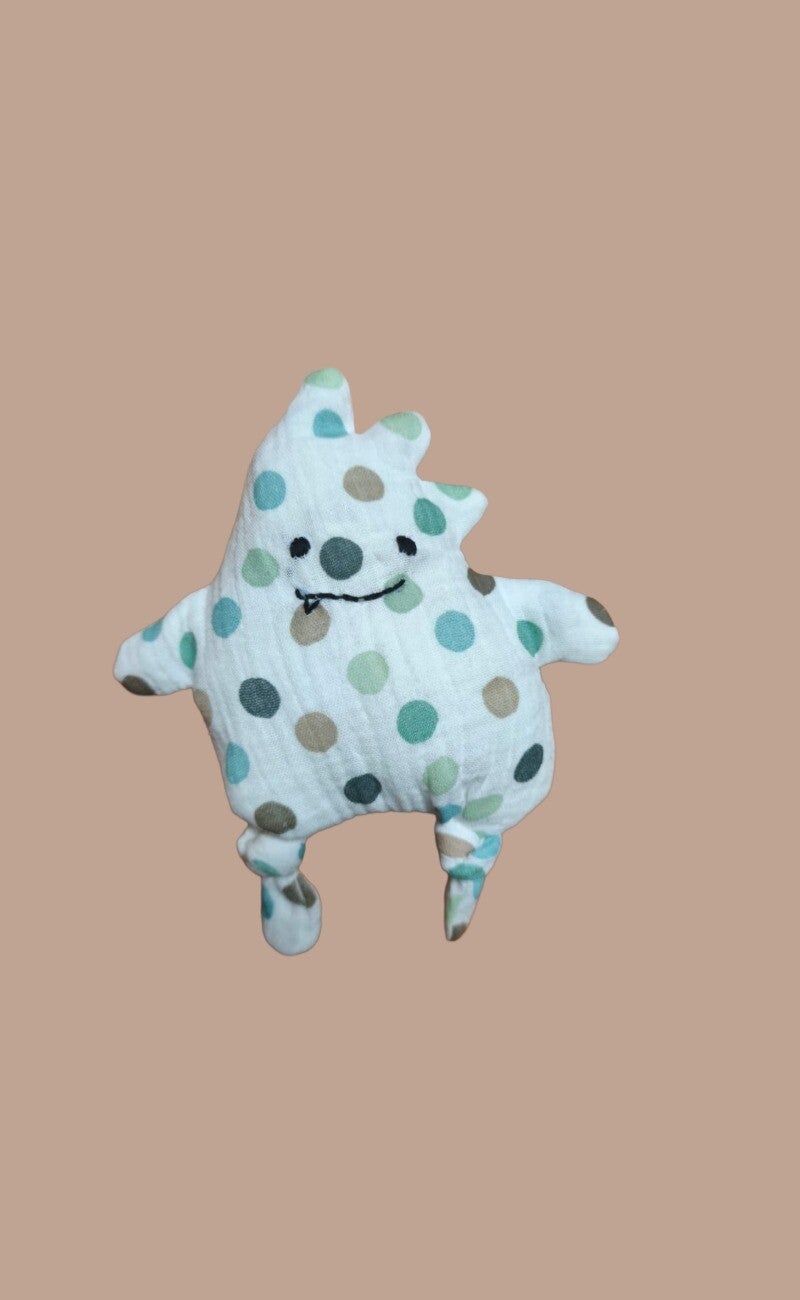 STOFFTIER DINO weiß mit Tupfen