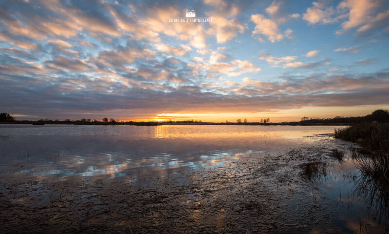 Een rustgevende zonsondergang op het Scharreveld, in de winter. Vastgelegd door Karen Brouwer