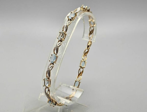 Vintage tennisarmband met diamant en topaas. 2025/59