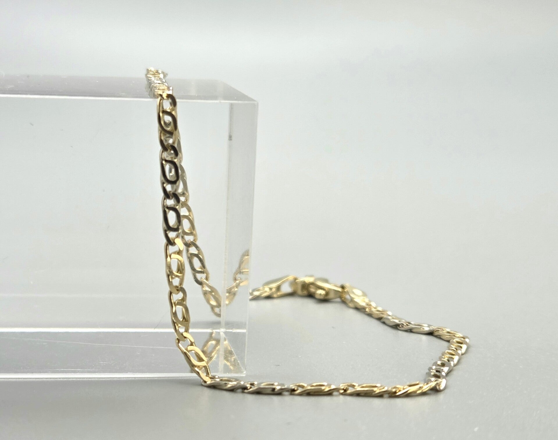 Vintage gouden bi-color valkenoog schakel armband. 2026/594