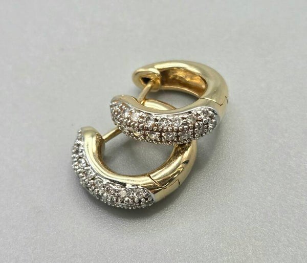 Vintage gouden klapcreolen met ca. 0.50 ct diamanten. 2025/596