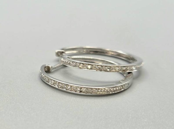 Vintage klapcreolen met ca. 0.16 ct diamanten. 2026/692