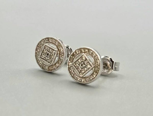 Witgouden oorknoppen met ca. 0,54 ct diamanten. 2026/703