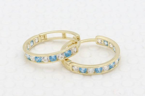 Gouden oorbellen met topaas en witte saffier. 2020/193.