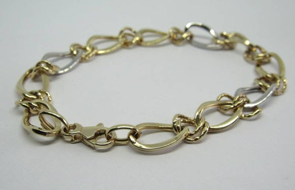 14 Karaat. Gouden schakel armband fantasie in wit en geel goud. Nr: 19/A447.