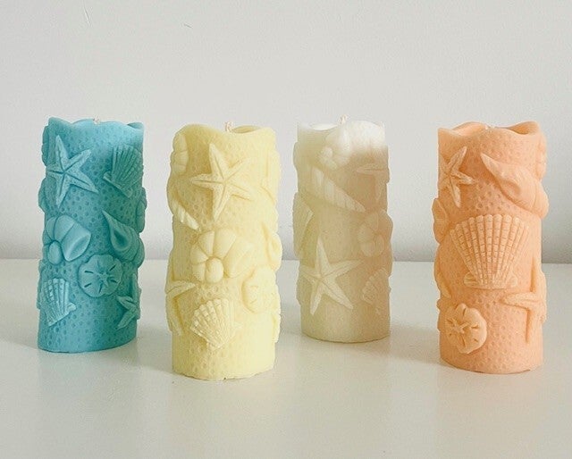 Hand gegoten stompkaars ''seashell'' met geuropties