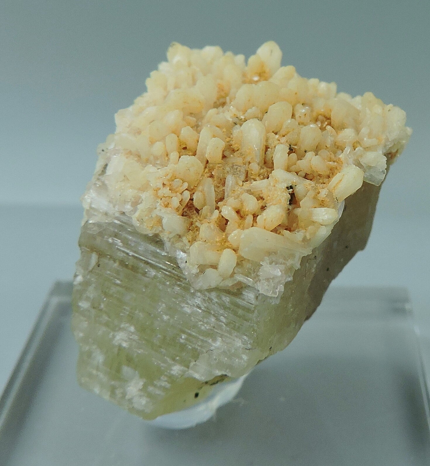Apatite crystal partly covered with stilbite crystals from Morocco - thumbnail