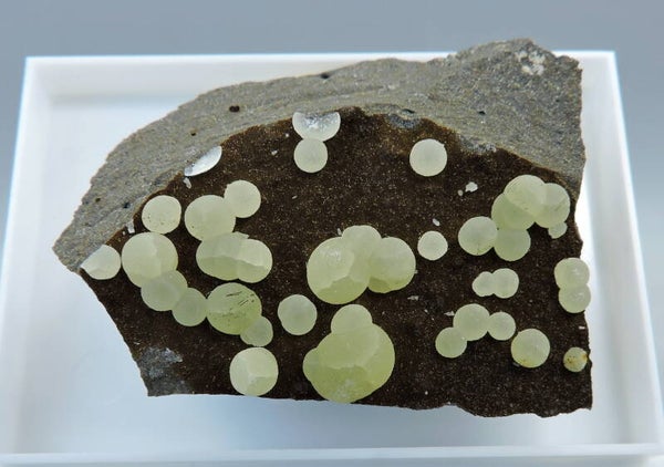 Calcite balls on matrix from Italy – miniature