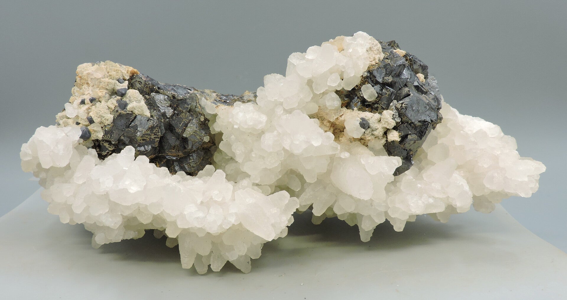 Pink fluorescent calcite on sphalerite from Kosovo – large cabinet size