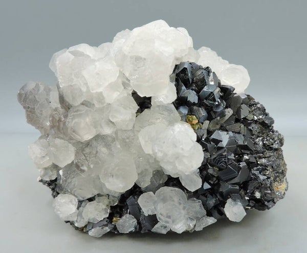 Pink fluorescent calcite on sphalerite from Kosovo – small cabinet size