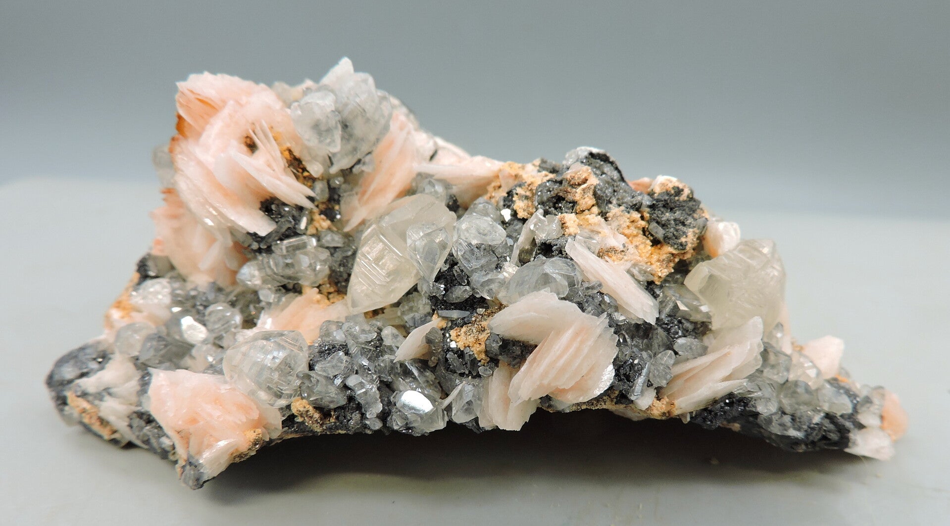 Fluorescent cerussite, pink baryte and galena from Morocco – cabinet size