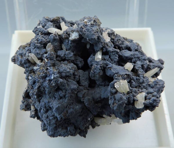 Cerussite on goethite from Spain – fluorescent – miniature