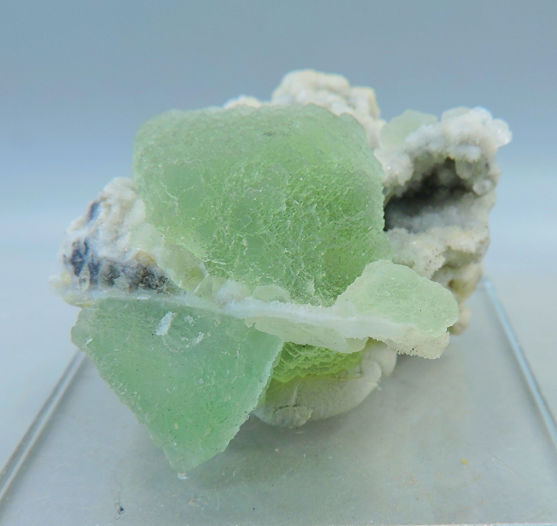 Green fluorite on drusy quartz from Russia – fluorescent – miniature
