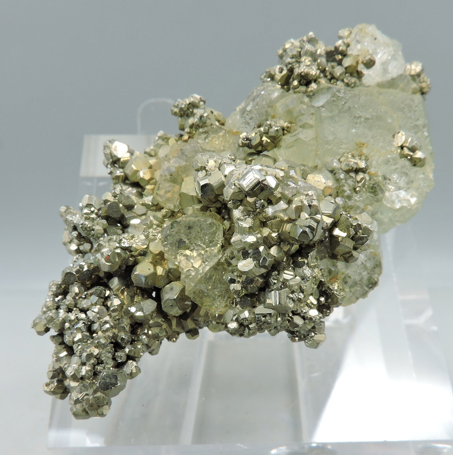 Pyrite on fluorescent fluorite from Peru – miniature