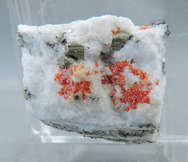 Realgar and pyrite in sugar dolomite from Switzerland – thumbnail
