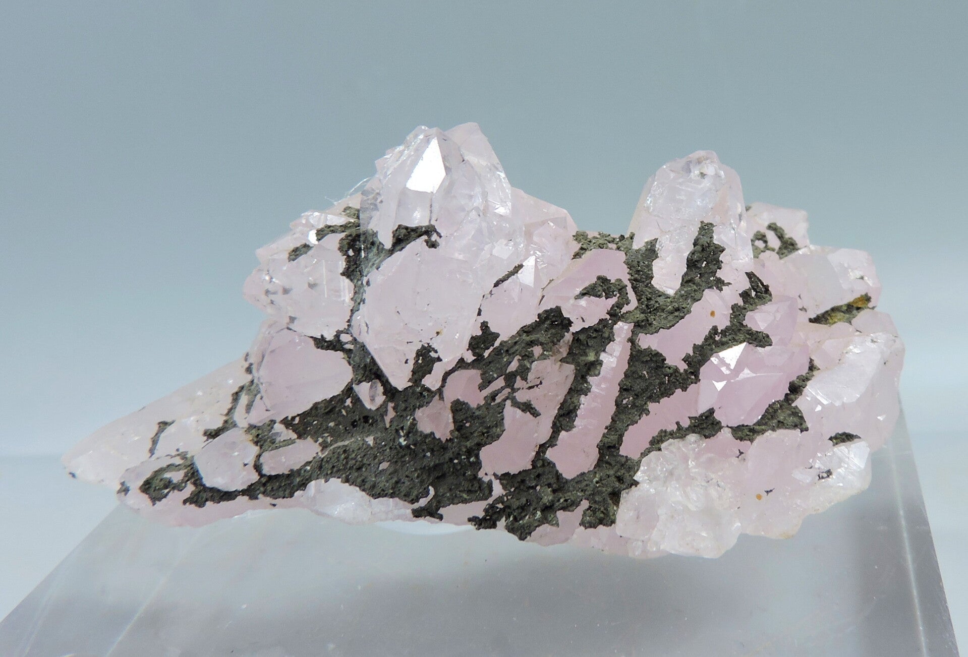 Rose quartz crystal cluster with ?? from Brazil – miniature