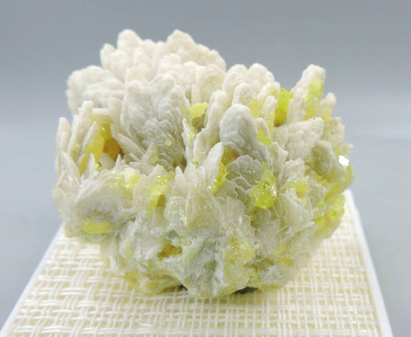 Native sulphur on baryte from Poland – fluorescent - miniature