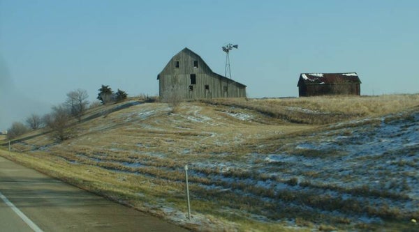 An Old Barn on a Hill.