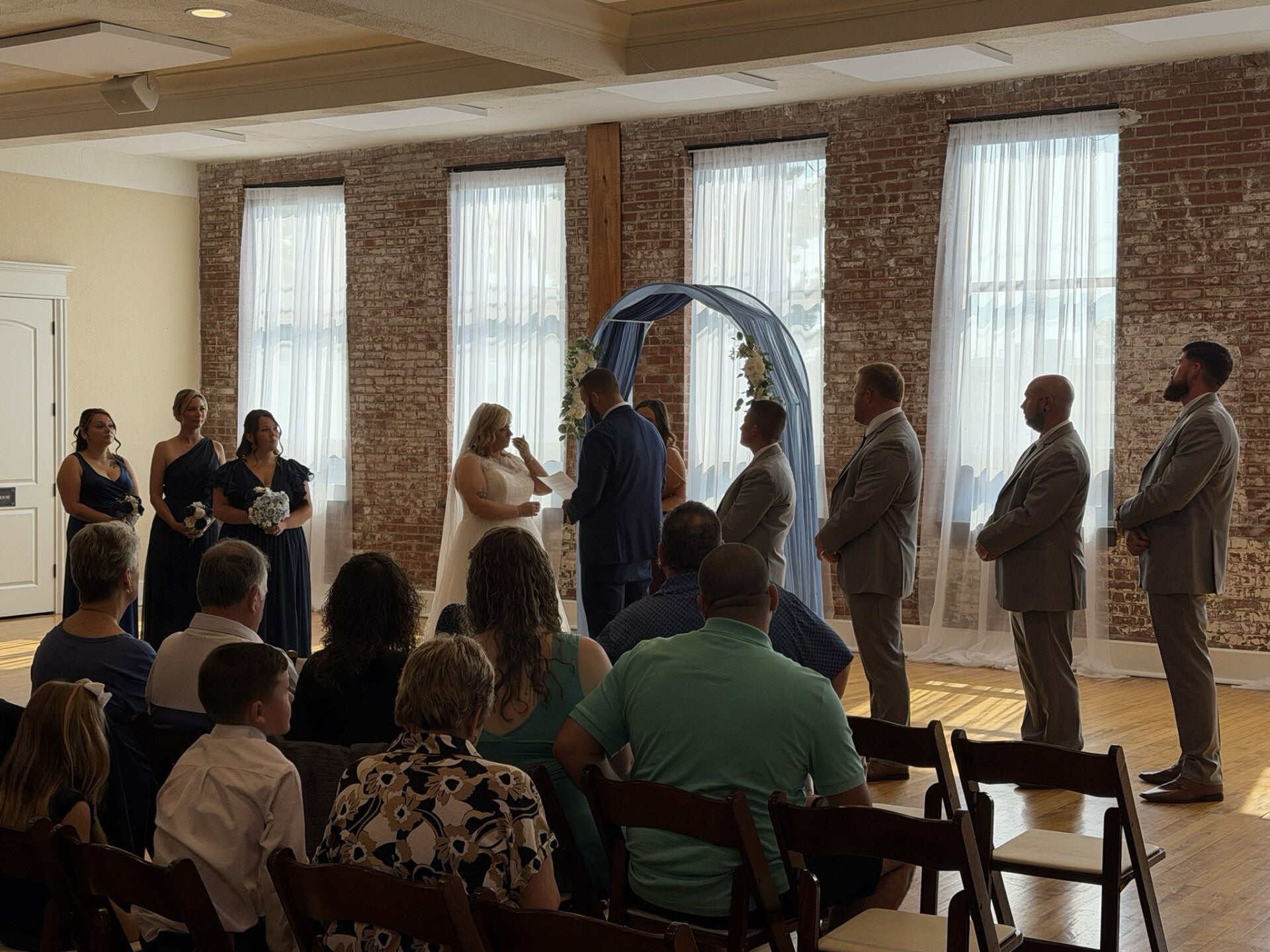Wedding celebration inside the exposed-brick interior of City View at Sterling Square