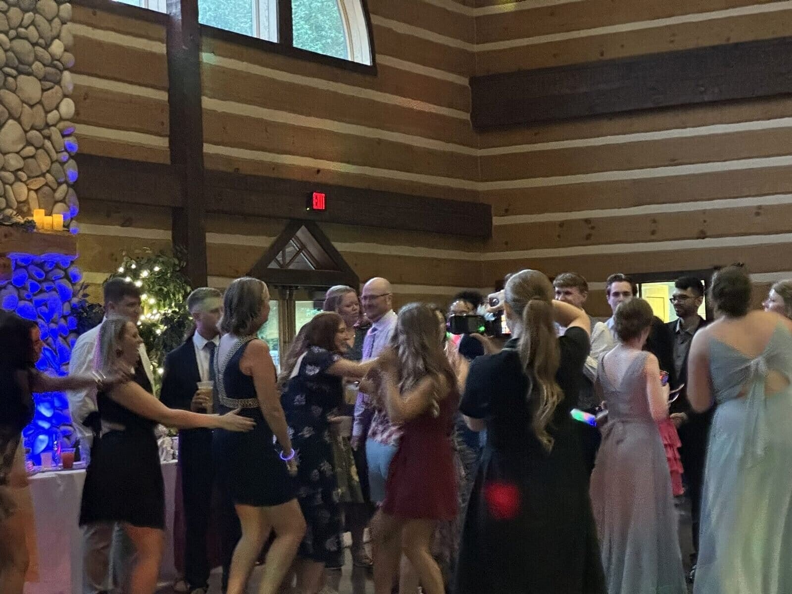 Wedding guests dancing inside O’Day Discovery Lodge in Evansville
