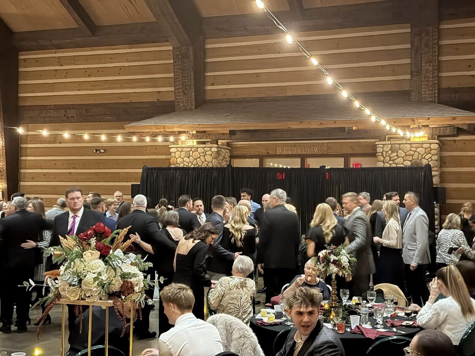 Wedding reception guests gathered inside O’Day Discovery Lodge in Evansville