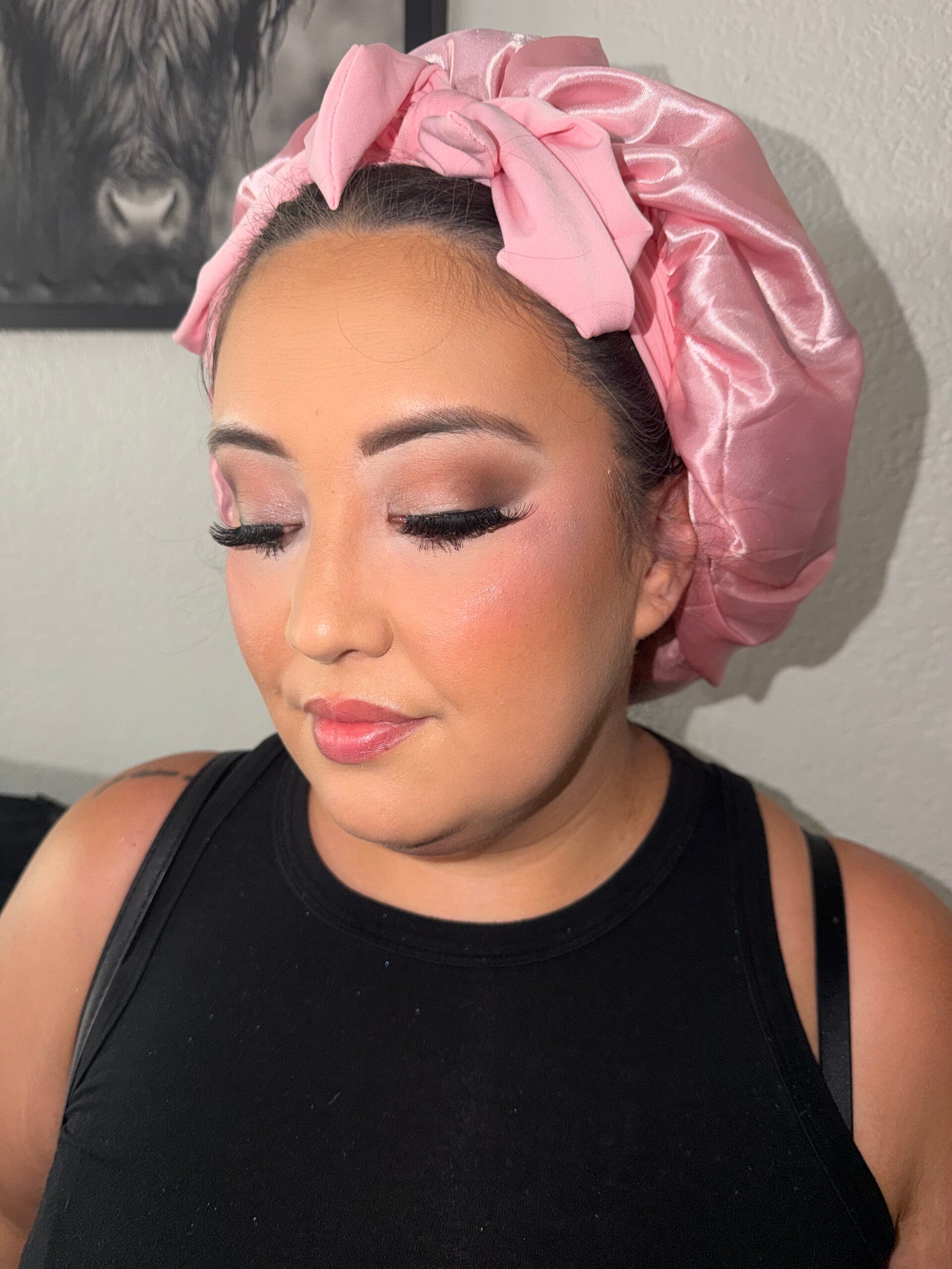 Warm rose glam makeup by Ashley Quick with softly blended shimmer, full lashes, glowing cheeks, and a glossy pink lip.