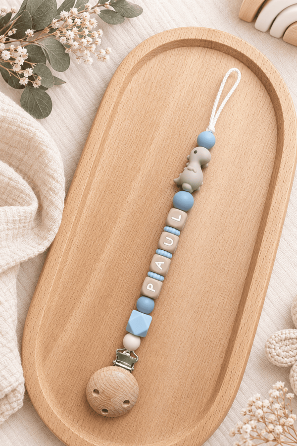 Attache tétine dinosaure beige bleu