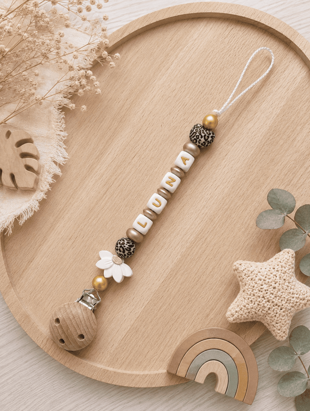 Attache tétine fleur leopard or