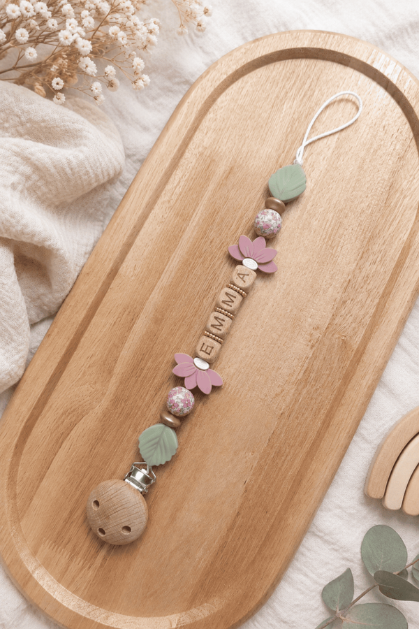 Attache tétine fleurs roses or
