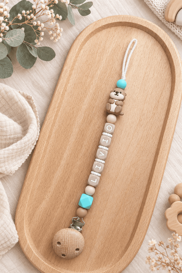 Attache tétine loutre turquoise
