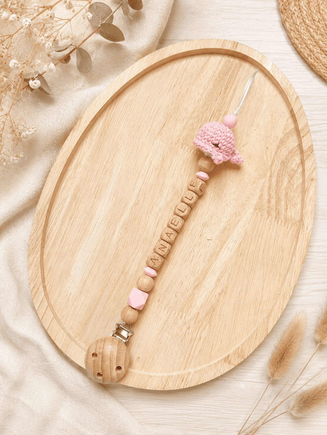 Attache tétine crochet baleine