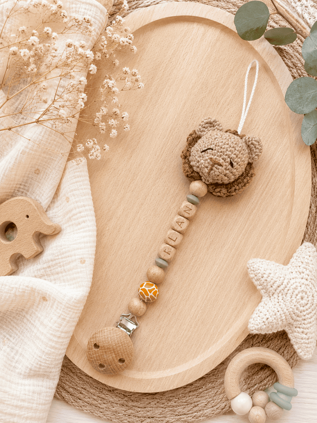 Attache tétine crochet lion
