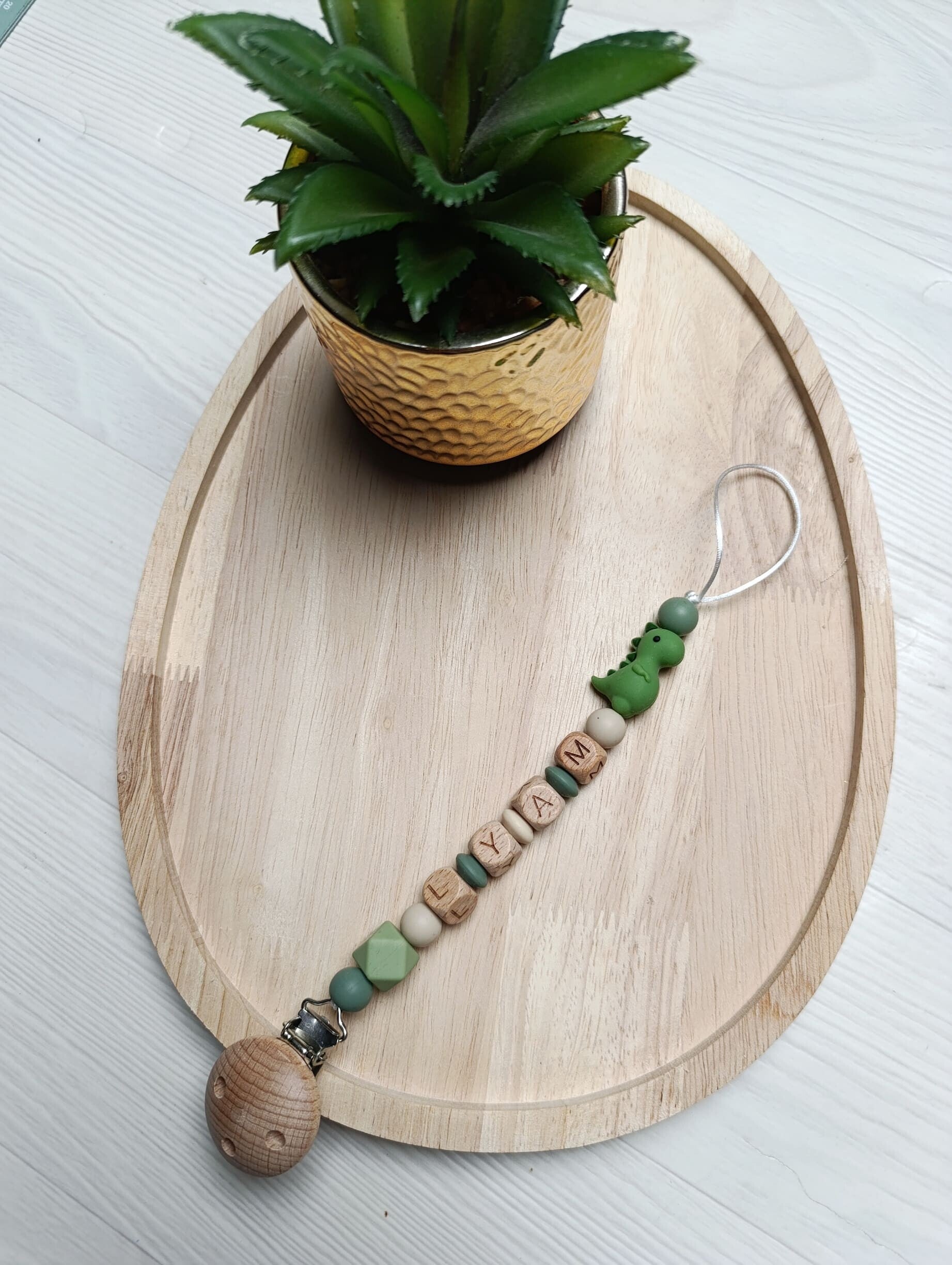 Attache tétine dinosaure