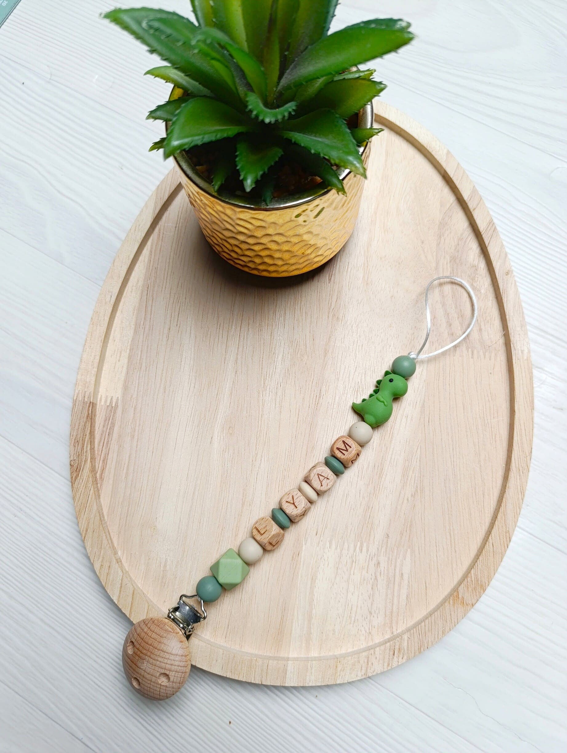 Attache tétine dinosaure