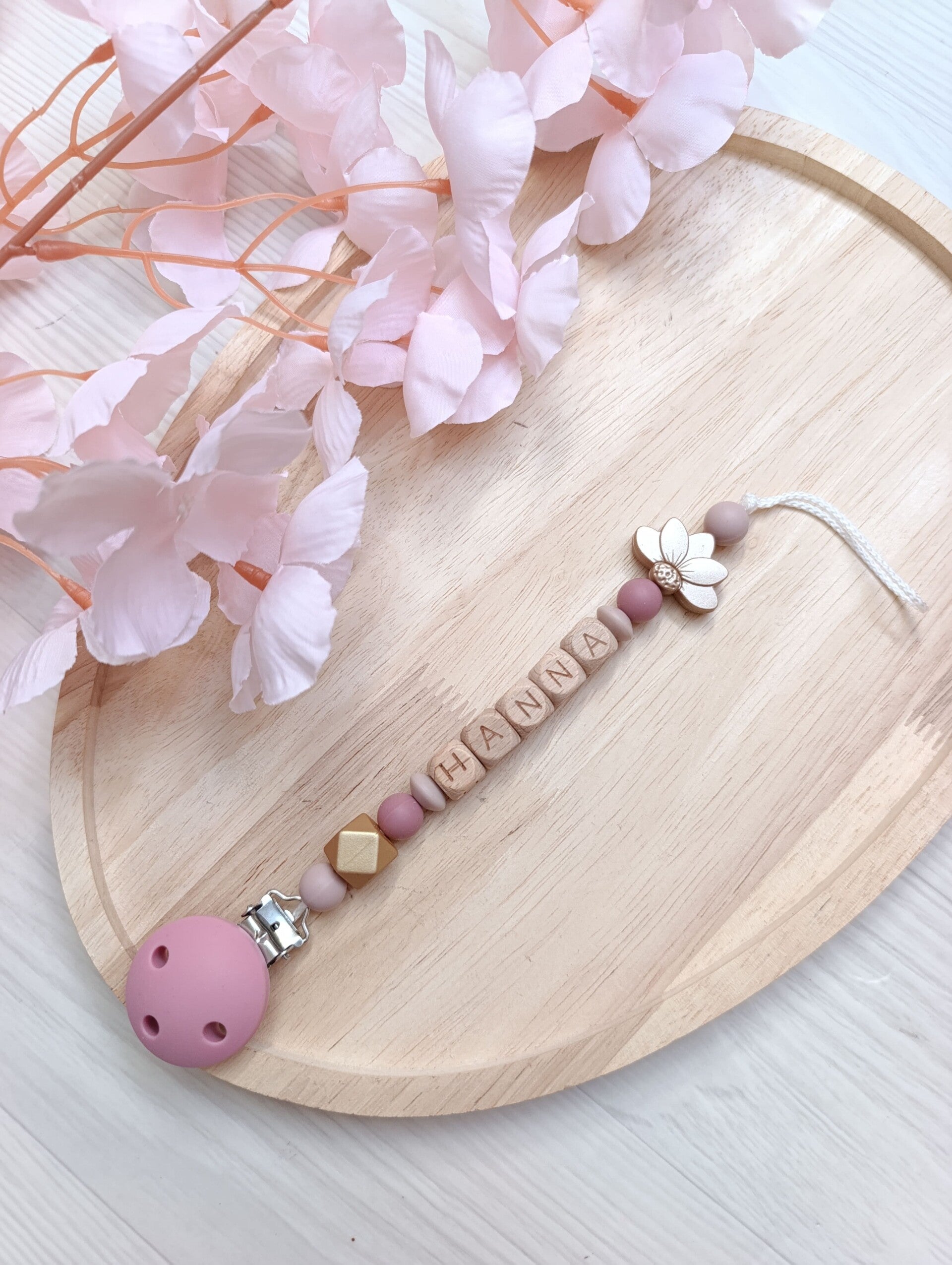 Attache tétine bois or