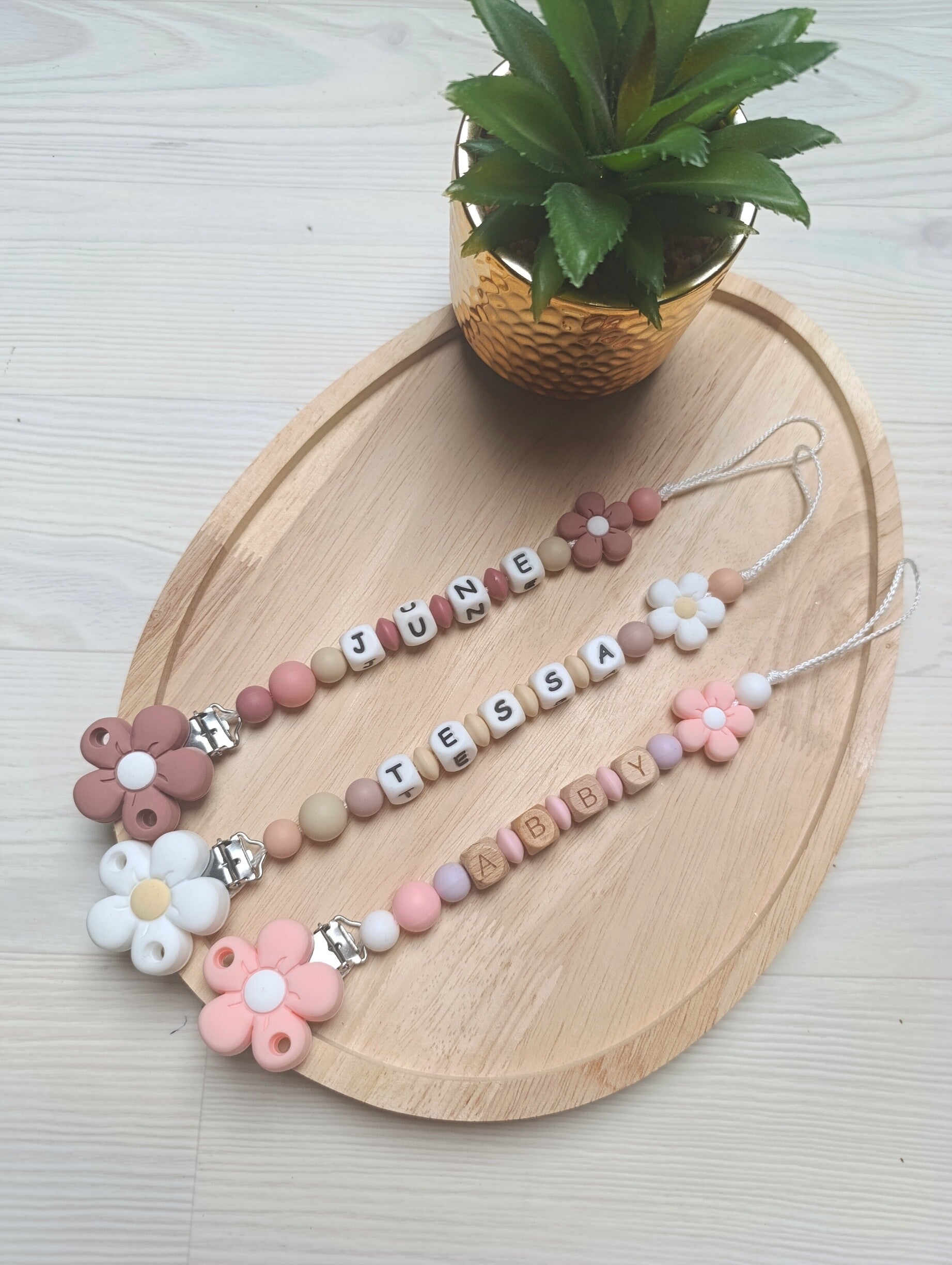 Attache tétine fleur