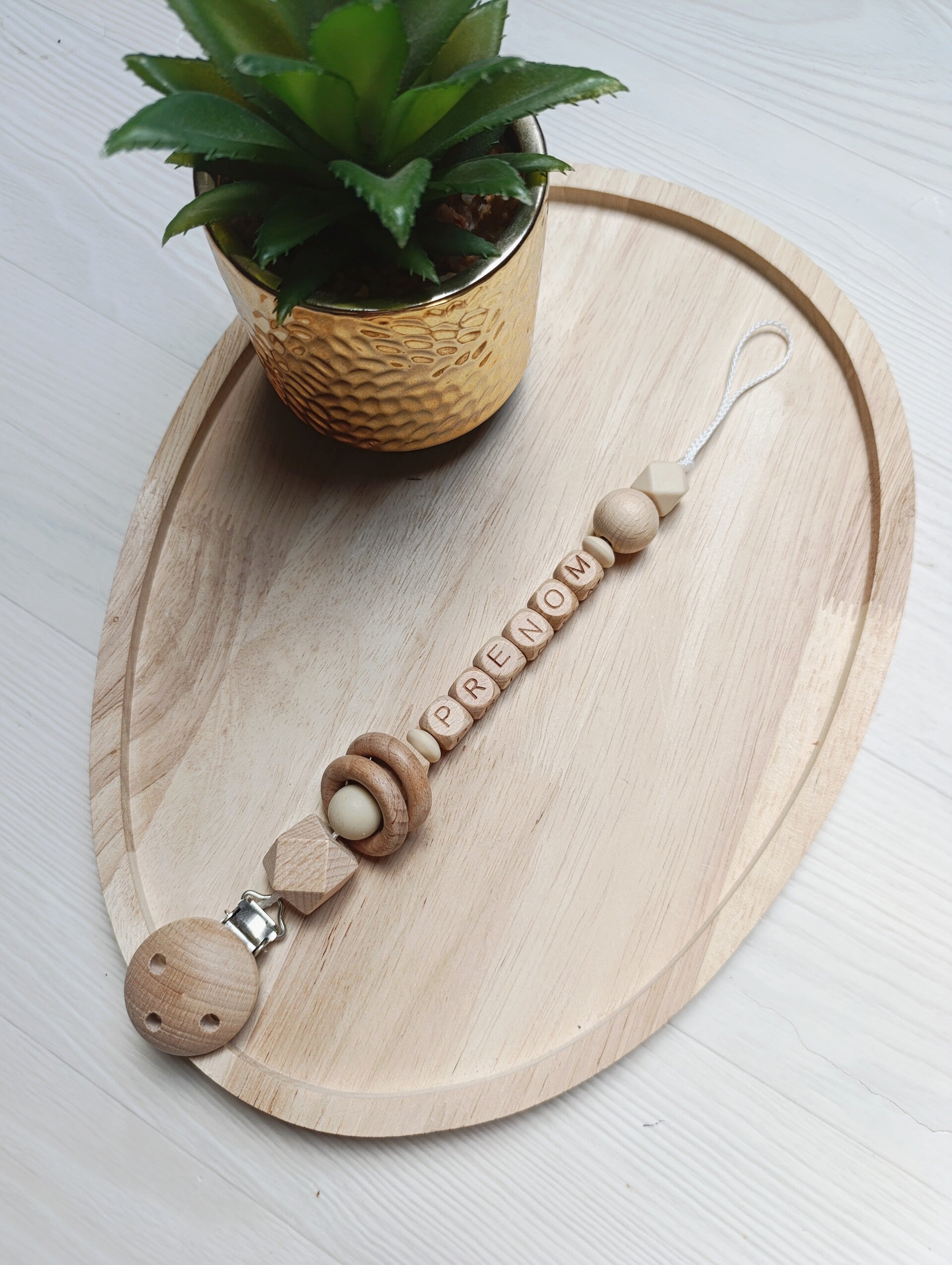 Attache tétine anneaux